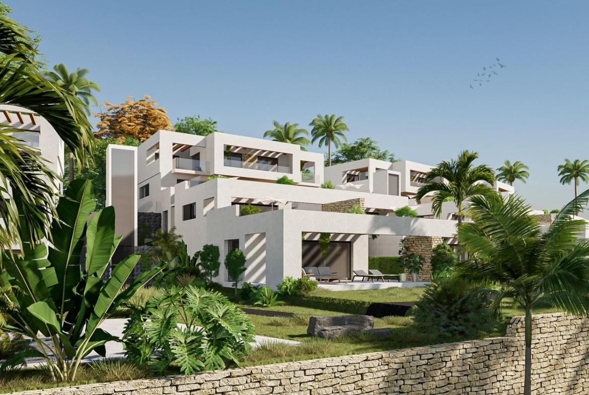 A panoramic view of Font del Llop Golf Course with modern duplex residences and a clear blue sky.