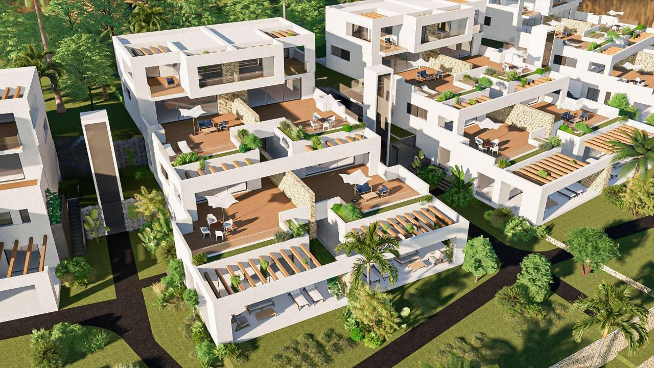 A panoramic view of Font del Llop Golf Course with modern duplex residences and a clear blue sky.