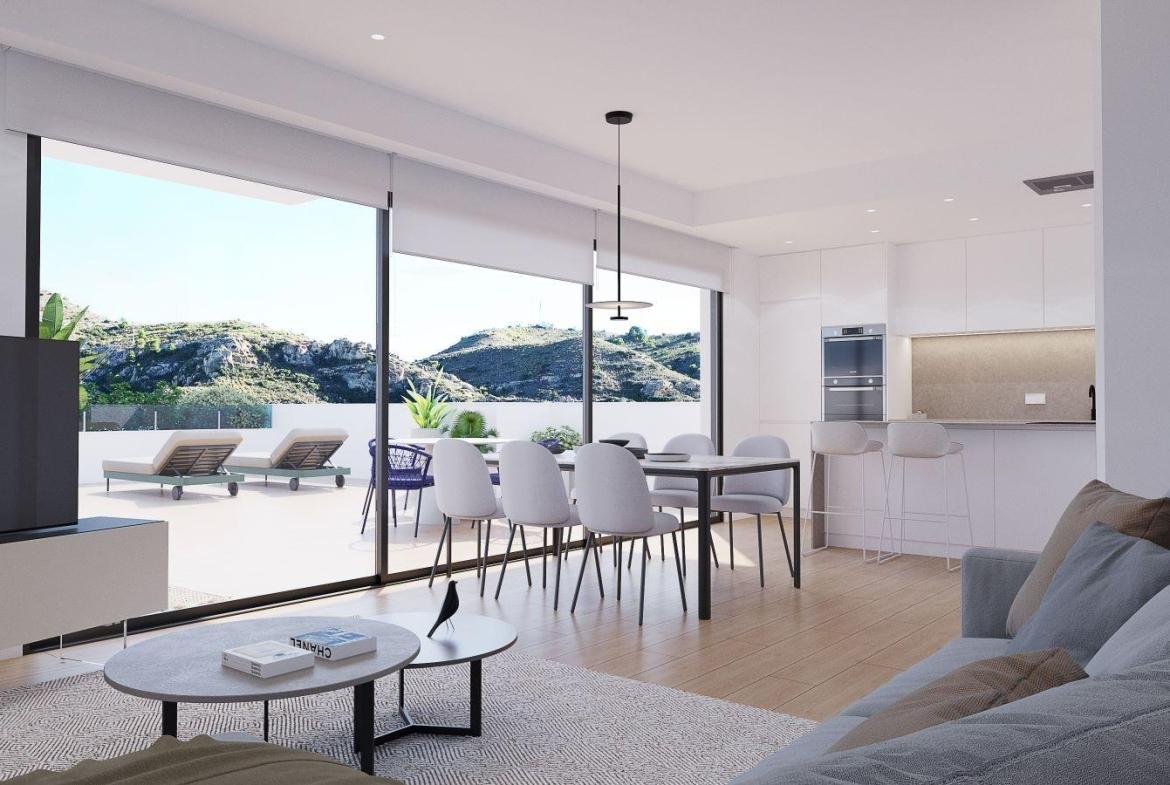 A panoramic view of Font del Llop Golf Course with modern duplex residences and a clear blue sky.