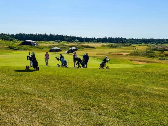 Golfers playing on the scenic fairways